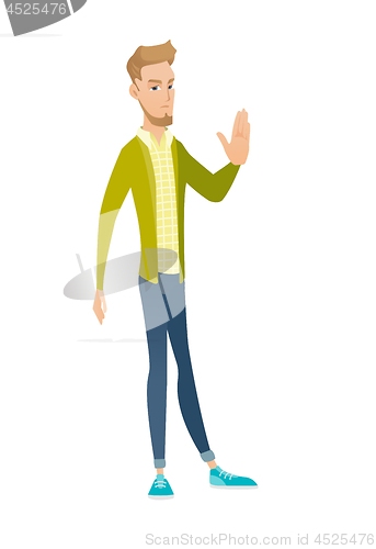 Image of Young caucasian businessman showing palm hand.