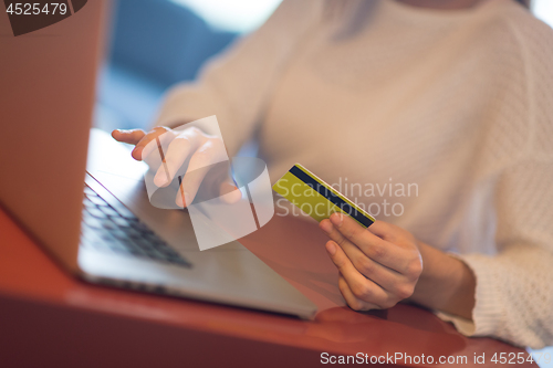 Image of woman  shopping  Online