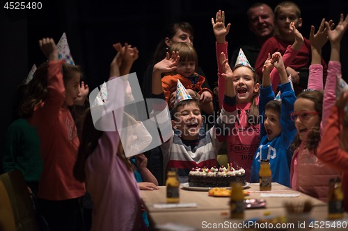 Image of The young boy joyfully celebrating his birthday