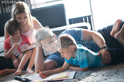 Image of young couple spending time with kids