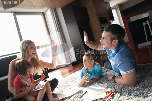 Image of young couple spending time with kids