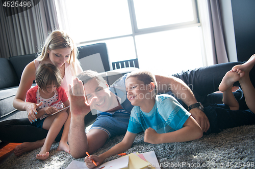 Image of young couple spending time with kids