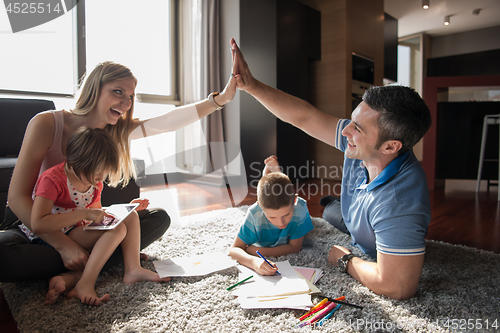 Image of young couple spending time with kids