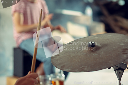 Image of Repetition of rock music band. drummer behind the drum set.