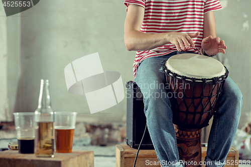 Image of Repetition of rock music band. drummer .