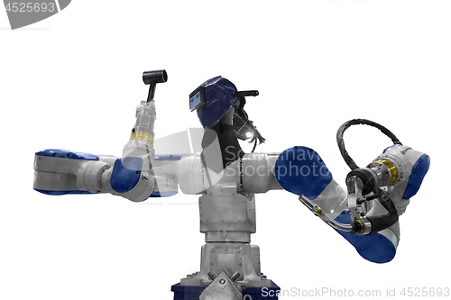 Image of Automatic robot arm working in industrial environment