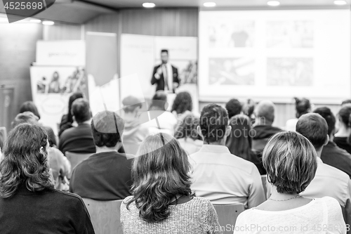 Image of Business speaker giving a talk at business conference event.