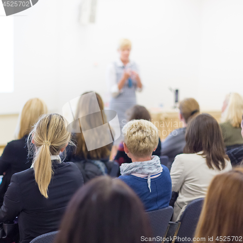 Image of Woman giving presentation on business conference.