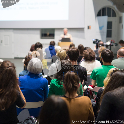 Image of Man giving presentation in lecture hall at university.