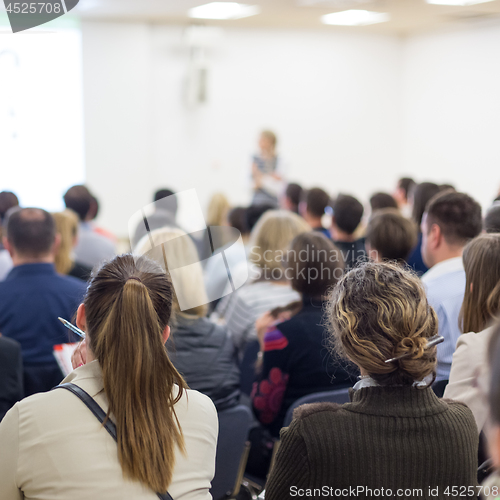 Image of Woman giving presentation on business conference.