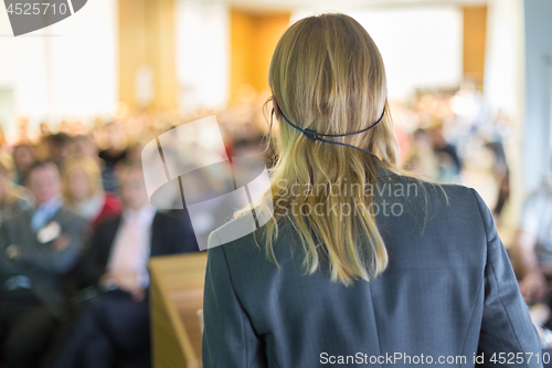 Image of Speaker at Business Conference and Presentation.