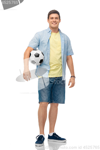 Image of smiling young man with soccer ball