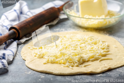 Image of Preparation of traditional pie with cheese.