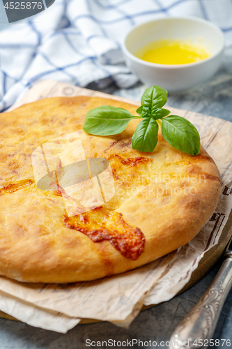 Image of Traditional pie (khachapuri) with cheese.