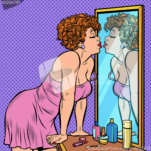 Image of woman in nightgown kissing her reflection in the mirror