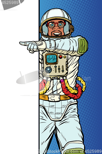 Image of african man astronaut. Point to copy space poster