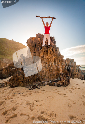 Image of Energetic motivated woman fitness beach