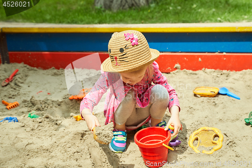 Image of Child on playground in summer park