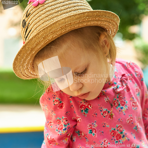 Image of Portrait of a sad little girl
