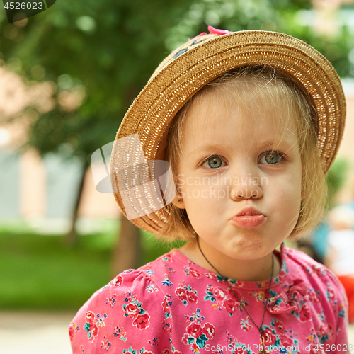Image of Portrait of a sad little girl