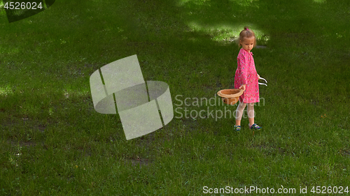 Image of Little girl walking in the park