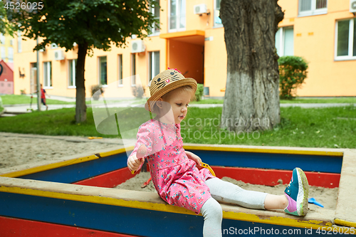 Image of Child on playground in summer park