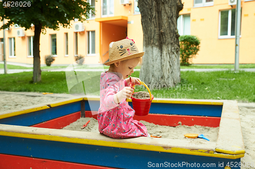 Image of Child on playground in summer park