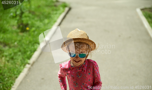 Image of Preschool girl in straw hat