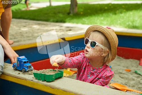 Image of Child on playground in summer park