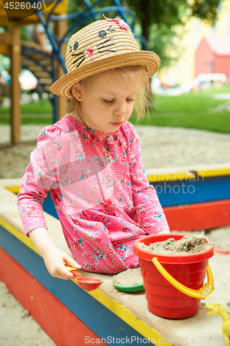 Image of Child on playground in summer park
