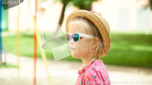 Image of Fashion portrait of girl child. Sunglasses.