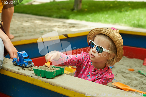 Image of Child on playground in summer park