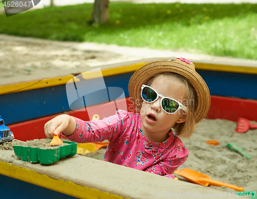 Image of Child on playground in summer park