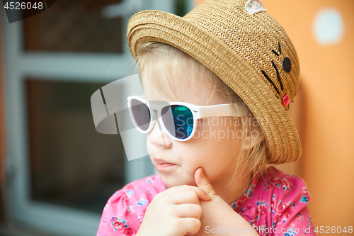 Image of Fashion portrait of girl child. Sunglasses.