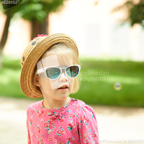 Image of Fashion portrait of girl child. Sunglasses.