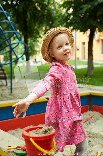 Image of Child on playground in summer park