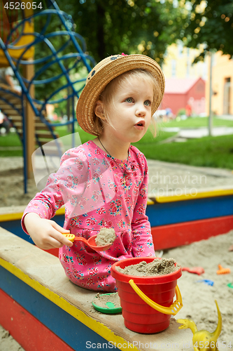 Image of Child on playground in summer park