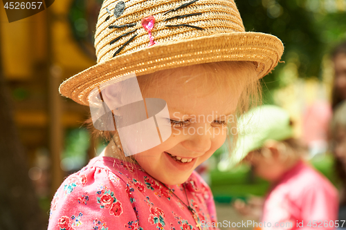 Image of Preschool girl in straw hat
