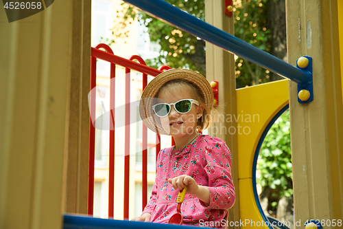 Image of Preschool girl in straw hat