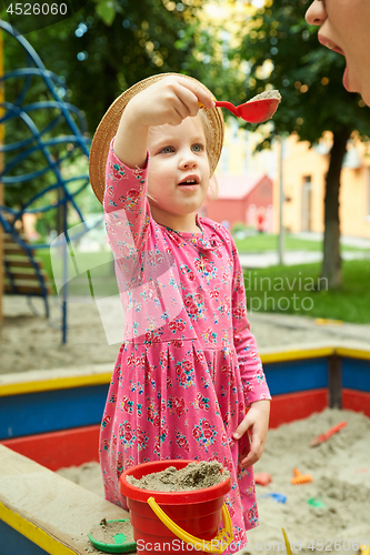 Image of Child on playground in summer park