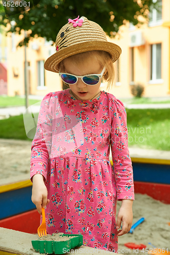 Image of Child on playground in summer park