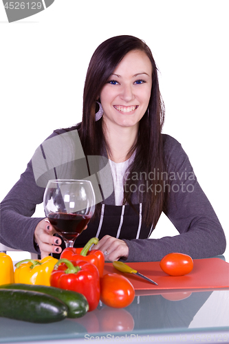 Image of Beautiful Girl with an Apron in the Ktichen