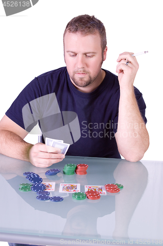 Image of Man with an Empty Whiskey Bottle on a Poker Table