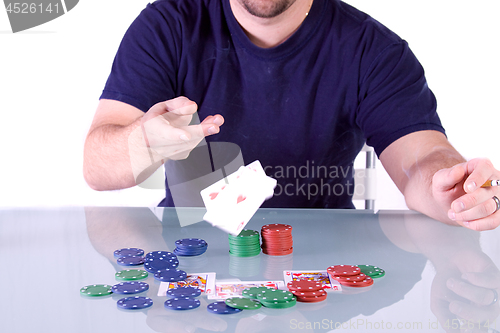 Image of Man Throwing Cards on the Table in Texas Hold'em