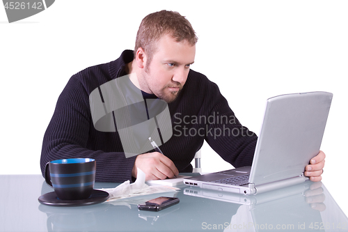 Image of Young Casual Businessman Working at his Desk