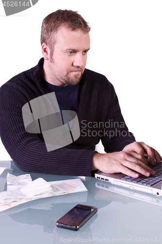 Image of Young Casual Businessman Working at his Desk