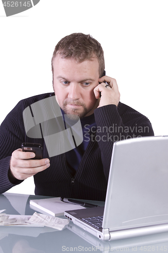 Image of Young Casual Businessman Working at his Desk