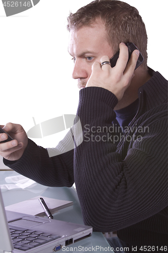 Image of Young Casual Businessman Working at his Desk