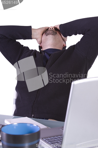 Image of Frustrated Young Casual Businessman Working at his Desk