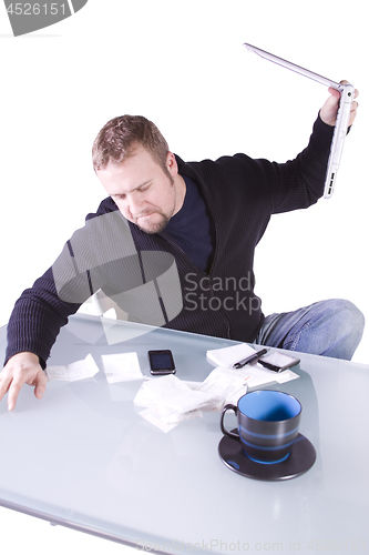 Image of Frustrated Young Casual Businessman Working at his Desk